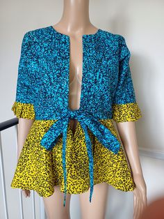 This beautiful Blouse is made with high quality Ankara/African print fabric, it is lined and fully stoned. It can also serve as Jacket.  How to style: It can be worn with camisole on Jean Trouser or any type of Skirt Can be worn by uk size 10-12 African Print Tops Blouses, African Print Blouse, Ankara Outfits, Ankara Blouse, Ankara Jackets, Nigerian Lace Styles Dress, African Blouses, Nigerian Lace Styles, Ankara Tops