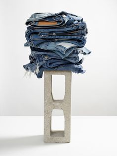 Clothing Still Life, Fashion Display Ideas, Denim Flatlay, Stack Of Clothes, Clothing Flat Lay, Jeans Storage Ideas, Jeans Storage, Denim 2024