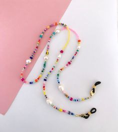 For more chains, please check out these listings: https://www.etsy.com/no-en/shop/Pearlsbymimmi?ref=simple-shop-header-name&listing_id=935334066&section_id=32595269 Delicate and colorful eyeglass and mask chain. I made it to look colorful and happy and allow you to wear your mask og glasses around your neck when not in use. Its also make a colorful long necklace. Silicone ends are adjustable to fit most glasses. Lobster claw attachments make it easy to replace silicone ends after too much wear & Spectacle Chain Diy, Sunglasses Beaded Chain, Beads Glasses Chain, Diy Glasses Chain, Glasses Chain Diy, Glasses Holder Necklace, Eye Glass Chain, Beaded Mask Chain, Beaded Glasses Chain