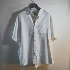 Causal Comfortable Button Up Button-up Vacation Shirt, Button-up Short Sleeve Beach Shirt, White Camp Shirt With Button Closure And Relaxed Fit, White Relaxed Fit Camp Shirt With Button Closure, Casual Collared Shirt With Buttons, White Button-up Camp Shirt With Placket, Summer Button-up Shirt With Buttoned Pockets, Casual Shirt With Buttoned Pockets And Casual Collar, Casual Short Sleeve Shirt With Buttons