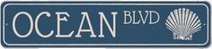 an ocean blvd street sign is shown in white and blue, with the word ocean on it