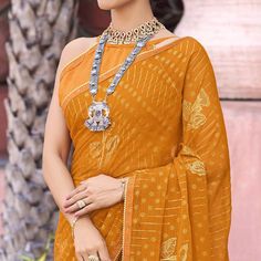 Mustard colored saree is made from chiffon fabric which is highlighted with beautiful foil printed & swarovski work as shown. Comes along with unstitched banglori blouse piece which you can customise as per your design/style. Occasion - You can wear this saree for festive, functions and fashionista. Note:- the actual product may differ slightly in color and design from the one illustrated in the images when compared with computer or mobile screen. Measurements: Saree : Chiffon : 5.5 Mtrs Blouse : Chiffon : 0.8 Mtr Material: Chiffon Stitch Type: Unstitched Country of Origin: India Care Guide: Dry Clean Saree Chiffon, Blouse Chiffon, Baby Skin Care, Mobile Screen, Silk Lehenga, Chiffon Saree, Foil Print, Chiffon Fabric, Blouse Piece