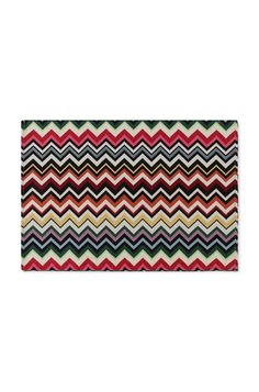 a multicolored striped rug with black, red, yellow and green stripes