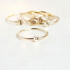 A teensy tinsy silver personalized initial ring so cute you'll fall in love!  This listing is for 14/20 gold filled. Customize this delicate stacking ring with the initial or symbol you desire for a very wearable, everyday ring.  The slim 1mm band and 4mm disk (slightly smaller than our original 5mm round - see comparison photo) makes this literally THE most perfect ring for stacking! Just the right find for a lucky momma or grandmother of many. Also sweet for creating a short word by stacking m Simple Personalized Initial Ring For Everyday, Personalized Yellow Gold Initial Ring For Everyday, Everyday Personalized Yellow Gold Initial Ring, Gold Stackable Rings With Initials For Everyday, Everyday Gold Stackable Rings With Initials, Adjustable Initial Ring For Everyday, Adjustable Initials Stackable Rings For Everyday, Adjustable Stackable Initial Ring As Gift, Simple Personalized Gold Stackable Rings