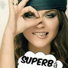 a woman wearing a bandana and holding her hands up to her face with the words super b on it