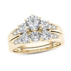 a yellow gold engagement ring set with three diamonds on the top and two rows of sides