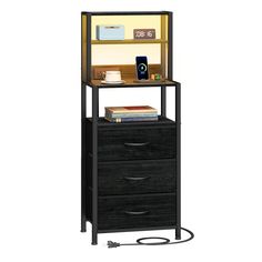 a book shelf with three drawers and a phone on top