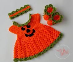 an orange crocheted baby dress and matching booties