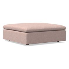 a beige ottoman sitting on top of a white floor