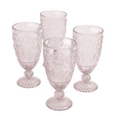 The Pioneer Woman Amelia 14.7-Ounce Rose Tea Goblet 4-Piece Set is a great way to freshen up your drinkware collection with classic looking glass goblets. The goblets in this set feature pink colored glass that stands out on any table with vintage-inspired embossed designs. With delicate yet durable stems that lead to an elegant fluted foot, these glasses add a touch of classic charm to your glass dinnerware collection. The Pioneer Woman Amelia 14.7-Ounce Rose Goblet is made from heavy and durab Pioneer Woman Glasses, Glass Dinnerware, Drinkware Sets, Serving Drinks, The Pioneer Woman, Bar Glassware, Mason Jar Wine Glass, Rose Tea, Pioneer Woman