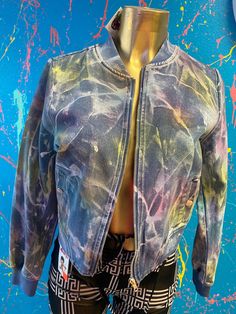 Jean jacket with pastel rainbow paint splatter all over Trendy Colorful Outerwear For Spring, Urban Multicolor Outerwear For Spring, Urban Multicolor Spring Outerwear, Colorful Casual Outerwear For Spring, Spring Blue Outerwear With Graffiti Print, Trendy Rainbow Outerwear For Fall, Colorful Cotton Spring Outerwear, Trendy Spring Outerwear With Graffiti Print, Trendy Cotton Outerwear With Graffiti Print