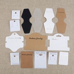 several different types of clothing tags on a table