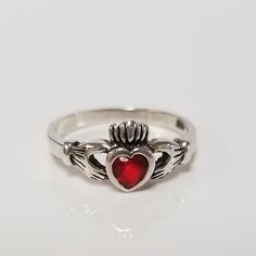 "Thanks for shopping our vintage estate store. We tend to sell well below wholesale and truly hope you enjoy all of our items. Many of the items are one of a kind, so please enjoy scrolling through the pictures and hopefully something will catch your eye. Brown spots are from the camera or reflections. Estate nice sterling silver 925 heart fire garnet Irish Claddagh ring. This is a custom made ring, meaning we added the gem to the setting. Ring size: please select size Settiing: 6mm 1/4\" Band w Vintage Promise Jewelry For Valentine's Day, Antique Sterling Silver Jewelry For Promises, Vintage Birthstone Rings For Valentine's Day, Vintage Heart Ring With Birthstone For Valentine's Day, Antique Sterling Silver Promise Jewelry, Vintage Sterling Silver Heart Ring Gift, Collectible Heart-shaped Ring For Valentine's Day, Vintage Heart Cut Birthstone Jewelry, Vintage Sterling Silver Birthstone Ring