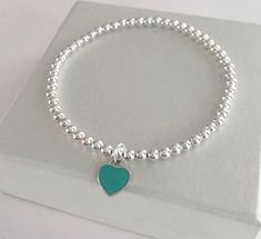 925 Sterling Silver Stretch Turquoise Heart Bracelet4mm Sterling Silver Beads10mm Sterling Silver Enamel HeartStack of 2 includes:one Heart Braceletone 4mm Plain BraceletStack of 3 includes:one Heart Braceletone 4mm Plain Braceletone 5mm Plain Bracelet*PRICE SHOWN IS FOR 1 HEART BRACELET ONLY*This bracelet is perfect for stacking or just wear on its ownFREE SHIPPING to Canada & U.S.A Sterling Silver Heart Beaded Bracelets, Sterling Silver Beaded Bracelets With Heart Beads, Sterling Silver Beaded Bracelet With Heart Charm, Elegant Sterling Silver Beaded Bracelet With Heart Charm, Sterling Silver Bracelets With Heart Beads, Sterling Silver Bracelet With Heart Beads, Valentine's Day Heart Shaped Sterling Silver Beaded Bracelets, Sterling Silver Heart Bracelet With Round Beads, Silver Heart-shaped Beaded Bracelets