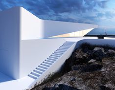 an artistic rendering of a white building with steps leading up to the roof and water in the background