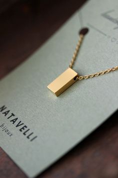 Minimalistic trendy geometric necklace with gold tone stainless steel 3D rectangular charm, steel jumping rings and stainless steel cable chain with steel lobster claw. Perfect for everyday wear and a great gift! The length of necklace is about 44.5 cm or about 17.5 inches. Other necklaces of my shop you can see here: https://www.etsy.com/shop/NaTavelli?section_id=14843046&ref=shopsection_leftnav_5 Thanks for a visit. Mens Bracelet Gold Jewelry, Simple Gold Necklace, Minimal Pendant, Abstract Pendant, Minimalist Necklace Gold, Modern Necklace, Gold Necklace Simple, School Jewelry, Mens Gold Bracelets