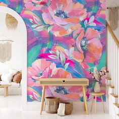 an artistic floral wallpaper in a living room with white stairs and pink flowers on the wall