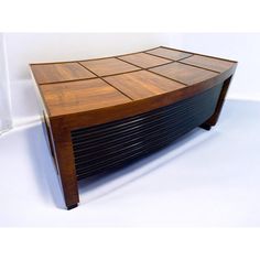 a wooden table that is made out of wood and has squares on the top surface