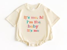 I'm The Baby, T Shirt Bubble Romper, Baby Bodysuit, Newborn Outfit, Baby Shower Gift, Funny Baby Gifts, Cute Baby Clothes, Baby Gifts 💗  Welcome to The WildflowerbyMiley Etsy Shop!  This listing is for the bodysuit, sweatshirt or t-shirt only. All other items that are shown in our photos such as shoes, hats, beanies, blankets etc. are for photo staging purposes and are NOT INCLUDED in the sale. DESCRIPTION:  This baby and children's unisex essential fits like a well-loved favorite. Super soft t-shirts, sweatshirts and baby bodysuits for your little lads and gals meant to showcase their big personalities. Its Excellent quality and vibrant print makes one fall in love with it over and over again.  This adorable piece is the perfect lightweight layer for casual wearing.  This product is hand Cream Cotton Bubble Romper With Short Sleeves, First Birthday Cotton Romper In Cream, White Summer Bodysuit For Gender Reveal, White Bodysuit For Summer Gender Reveal, Summer Onesie With Letter Print For Gender Reveal, Short Sleeve Letter Print Bodysuit For Gender Reveal, Baby Shirt Design, Funny Baby Shirts, Funny Baby Gifts