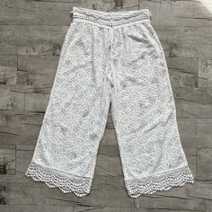 These Are The Cutest Pants; I Wanted These So Badly When These Were Realeased -- I'm Shocked I Can't Find Any Others Listed Online, Probably Because No One Wants To Give Them Up -- I Was So Upset When I Got These And Was No Longer An Xl. These Pants Are So Incredible; They Are A White Lace And Have A Wide Leg Opening And Lace Throughout. They Have A Tie Waist And Made Of The Cutest Daisy Floral Print Throughout, They Are Absolutely Lovely. White Wide Leg Bottoms With Lace Trim, Summer Wide-leg Bottoms For Brunch, Bohemian Bottoms With Elastic Waistband For Brunch, Summer Long Pants With Lace Trim, Bohemian White Bottoms For Loungewear, Bohemian Wide Leg Bottoms For Brunch, Casual Summer Pants With Lace Trim, Long Pants With Lace Trim For Summer, Casual White Pants With Lace Trim