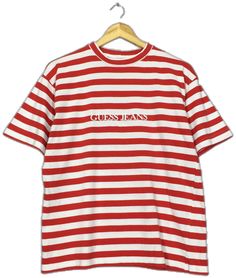 Vintage 90s Guess Jeans Striped T Shirt Small Guess Jeans Usa Rocky Border Stripes Shirt Guess Georges Marciano Red White Stripe Tees Size S Good Used Condition. No holes and stains. Size (On Tag) : None but fit like Size S **To make sure if it FITS YOU, refer at the exact measurements. Size Measurement (All measurements were taken lying flat) : Width [armpit to armpit] : 20.5 inches / 52 cm Length [shoulder to end of garment] : 25 inches / 64 cm THIS IS USED CLOTHING! PLEASE DON`T EXPECTED IT T 90s Style Red Cotton Shirt, Red Crew Neck Top 90s Style, 90s Red Streetwear Shirt, 90s Red Shirt For Streetwear, 90s Red Crew Neck Top, Retro Red Crew Neck Top, Striped Crew Neck Top With Logo Print, Retro Red Crew Neck Shirt, Vintage Red Tops With Letter Print