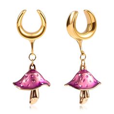 a pair of gold earrings with pink and purple enamel mushrooms on the front, hanging from hooks