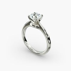 a white gold engagement ring with a single diamond