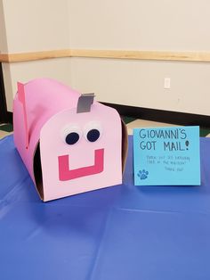 a paper bag with a face on it and a sign that says glovanin's got mail