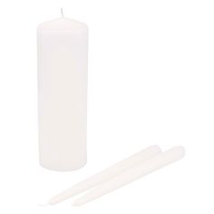 two white candles next to each other on a white background