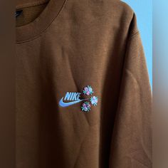 Brown Nike Crewneck With Flower Iron Patches, Only Worn Once. Basically Brand New!! Brown Nike Crewneck, Iron Patches, Nike Crewneck Sweatshirt, Nike Brown, Nike Crewneck, Nike Tops, Crewneck Sweatshirt, Nike Women, Crew Neck Sweatshirt