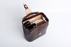 "*DOCTOR BAG'S HANDMADE VIDEO* https://youtu.be/QpdhSCjh2BM Product Description * Material: vegetable tanned leather * Color: Hand-dyeing -Chocolate * Flap over entry with magnetic buckle closure * 0.75\" wide leather shoulder strap adjust from 36.61\" to 44.88\" * Sewn by hand; * Size: 170mm (H) x 180mm (W) x 110mm (D) / 6.7\" x 7.0\" x 4.3\" The Installation of Doctor Bag Frame #Please see the last picture# Doctor Bag Frame is connected by two pairs of screws. Although we will tighten the scre Leather Doctor Bag, Leather Phone Bag Satchel For Daily Use, Leather Phone Bag For Everyday Use, Office Shoulder Bag With Cell Phone Pocket, Rectangular Office Shoulder Bag With Cell Phone Pocket, Leather Phone Pouch Bag For Office, Leather Satchel Phone Bag, Office Bag With Cell Phone Pocket, Rectangular, Office Bag With Cell Phone Pocket