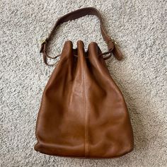 Pre Owned. In Great Used Vintage Condition. Some Light Normal Wear. No Holes Or Rips. Shipped Via Usps Priority Mail. Please Contact Me For Any Additional Photos Or Questions Vintage Bucket Bag With Detachable Strap For Travel, Coach Bucket Hobo Bag With Detachable Strap, Classic Coach Bucket Bag For Everyday Use, Coach Bucket Bag For Shopping, Coach Bucket Bag For Travel, Coach Bucket Bag For Everyday, Everyday Coach Bucket Bag, Classic Coach Crossbody Bucket Bag, Classic Coach Bucket Bag For Daily Use