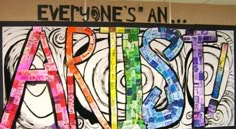 an art project is displayed on the wall in front of a sign that says everyone's an artist