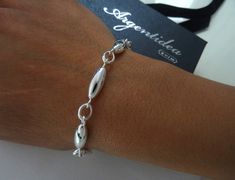 Brand: Argentidea Jewelry Instagram: https://www.instagram.com/gioielli_argentidea/ Measurement: 21cm Weight: 12g. Silver colour 925 silver bracelet for women, chain with ovals with an external diameter of 6 mm joined by oval roll links. The bracelet features an oval lobster clasp. Simple, linear and always current bracelet. The bracelet is the natural color of silver, manually polished to a shiny finish. A completely handcrafted jewel, conceived, designed, produced and finished entirely by hand Silver Bracelet For Women, Logo Jewelry, Handcrafted Silver Jewelry, Jewelry Instagram, Silver Bracelets For Women, Women Chain, Bracelet Simple, 925 Silver Bracelet, Silver Colour