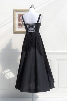 Our bestselling midi is now available in black! The Meadowlark features a vintage-style boned bodice with open, lace-up corset back, adjustable shoulder straps, a flowy tea-length skirt, and romantic sweetheart bustier neckline. A note on sizing- while this dress has an adjustable bust size due to the corset-style back, the waist is a single measurement and has no stretch, please check sizes below. . Details: S: Bust: 32"-36", Waist 26" M: Bust 34"-38", Waist 28" L: Bust 36"-40", Waist 30" Lengt Black A-line Corset Dress With Boned Bodice, Black Square Neck Corset Dress For Spring, Fitted A-line Corset Dress With Lace-up Back, Black Underbust Corset Dress For Summer, Black Corset With Sweetheart Neckline For Spring, Spring A-line Corset Dress With Corset Back, Elegant Black Corset Dress With Lace-up Back, Spring Sleeveless Corset With Ruched Bodice, Black Corset Dress With Fitted Bodice And Square Neck