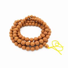 "This is a genuine Bodhi mala made from Bodhi seeds. The seeds were sourced from rare Bodhi trees that can be only found in a few regions of Nepal. Bodhi trees have sacred significance in Buddhism as it was this tree species under which Gautama Buddha attained enlightenment.  Also known as the Buddha Chitta mala, this type of prayer mala is mostly used by lamas and Buddhist devotees. With unique phoenix eye patterns and textures, this bodhi mala is a great meditation tool to enhance and help foc Adjustable Polished Beads Mala For Meditation, Adjustable Mala With Polished Beads For Meditation, Brown 8mm Beads Mala For Rituals, Brown Mala With 8mm Beads For Rituals, Spiritual Mala With Round Wooden Beads, Brown Spiritual Mala With Polished Beads, Spiritual Brown Mala With Polished Beads, Spiritual Round Mala For Meditation, Brown Polished Beads Spiritual Mala