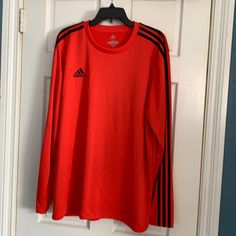 Red With Trademark Black Strips On Sleeves. In Perfect Condition. Never Worn. Adidas Long Sleeve Sports T-shirt, Red Long Sleeve Sports T-shirt, Red Long Sleeve Sports Top, Adidas Red Sports Top, Adidas Climalite, Red Adidas, Long Sleeve Jersey, Adidas Men, Black Red