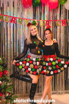 two women dressed up in christmas costumes posing for the camera