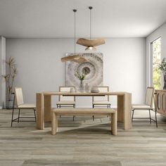 a modern dining room with wood flooring and white walls, an art work on the wall