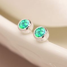 A stunning pair of twinkling green bello opal stud earrings made from sterling silver Guaranteed to add a touch of sparkle to any look, our bello opal earrings are crafted from the finest sterling silver with a green bello opal centre. Our green bello opals shine like the northern lights with flashes of blue, red and gold.  These dainty silver stud earrings feature a classic butterfly and post fastening and are suitable for almost any age. A lovely Christmas gift, stocking filler or for a birthd Silver Opal Earrings For Anniversary, Anniversary Silver Opal Earrings, Green Opal Birthstone Jewelry, Opal Stud Earrings, Opal Earrings Stud, Bespoke Gifts, Opal Studs, Green Opal, Silver Stud Earrings