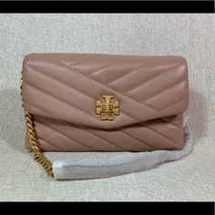 Price Is Firm Kira Chevron Chain Wallet By Tory Burch. This Bag Is Made Of Soft Pink Lamb Skin. Dimensions: 8" Wide Across Bottom X 5" Tall Center X 1.5" Deep. Strap Length 48". Not Adjustable. Interior: 2 Compartments. 1 Zipper Compartment In The Center, 6 Credit Card Slots, 1 Bills Compartment 1 Patch Pocket On The Back Flap Closure Secured With Turn Lock. Fabric Lining. Rolled Brass Tone Metalware. Elegant Pink Crossbody Clutch, Rectangular Pink Wallet On Chain For Evening, Chic Pink Wallet On Chain With Chain Strap, Elegant Pink Rectangular Wallet On Chain, Chic Pink Wallet On Chain For Formal Occasions, Elegant Pink Wallet On Chain For Evening, Elegant Pink Evening Wallet On Chain, Elegant Pink Wallet On Chain With Strap, Luxe Handbags