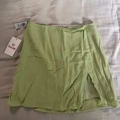 Aritzia Tatiana Green Skirt Size 8. Never Worn Green Flowy Skort In Short Length, Flowy Green Skort With Short Length, Green Lined Short Skirt, Green Short Lined Skirt, Solid Color Mini Wrap Skirt For Spring, Spring Solid Color Mini Wrap Skirt, Solid Color Spring Mini Wrap Skirt, Fitted Green Wrap Skirt For Vacation, Spring Vacation Pencil Skirt