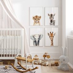 a baby's room with white walls and pictures on the wall