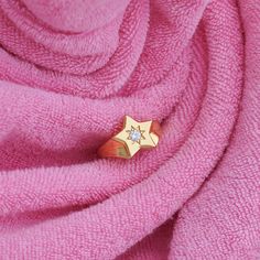 Shine like the brightest star with this chunky signet ring, part of our Retro Charmed collection, this design is bursting with nostalgia! The whimsical shooting star signet features a sweet sparkling stone engraved with starburst details for a dazzling finish.  Express your personal mood and style with our Retro Charmed Collection. Collect the charms to layer them up, or keep it simple the choice is yours! Please see final image for size conversion chart  Size Extra Small = US 5 or UK J 1/2 Size Playful Jewelry, Horseshoe Necklace, Disc Necklace, Shooting Star, Shooting Stars, Bright Stars, Pink Velvet, Keep It Simple, Everyday Jewelry