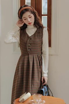 A two-piece set featuring a basic mock neck long sleeve sweater and a plaid pinafore dress with a button front, waist ties and midi skirt. S: 32" chest and waist, 41.5" lengthM: 33.5" chest and waist, 41.5" lengthL: 35" chest and waist, 41.5" length Long Plaid Skirt Outfit, Long Plaid Skirt, Plaid Skirt Outfit, Plaid Outfits, Mock Neck Long Sleeve, Fallen Leaves, Pinafore Dress, Turtle Neck Dress, Feminine Outfit