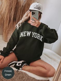 Prices are on the rise daily! 📈🚀 NY Sweatshirt, New York Sweatshirt, New York Crewneck trendy state sweatshirt NYC Crewneck Minimalist NY Unisex Sweatshirt Gift For Traveler PLEASE TAKE A MOMENT TO READ THE FOLLOWING IMPORTANT INFORMATION. IF YOU HAVE ANY QUESTIONS, WE'RE HERE TO ASSIST! KEY FEATURES 🌟 * Classic Unisex Design: Fits like a well-loved favorite for both men and women. * Soft Cotton Material: 100% Airlume combed and ring-spun cotton offers exceptional softness and breathability. New York Crewneck, New York Shirt, Gift For Traveler, New York Sweatshirt, Unisex Design, Favorite Things Gift, Unisex Sweatshirt, Cotton Material, Tee Shirt