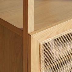 a close up of a wooden cabinet with perforated screen on the front and sides