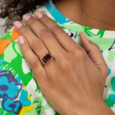 The Story Made from warm 18 karat yellow gold, this chic vintage ring centers around a rectangular garnet. A thick and substantial bezel and band frame the richly colored stone. Created in a beautiful sculptural shape, the classic signet ring style lines flow down the band. The size and scale feels amazing on the finger. We love it worn alone or styled alongside a handful of stacked rings for a "more is more" look. The Specs Style Number: R3229 Vintage, circa 20th century 18k yellow gold Garnet- Classic Yellow Gold Rectangular Amethyst Ring, Elegant Rectangular Amethyst Ring In Yellow Gold, Luxury Rectangular Ruby Ring, Luxury Rectangular Gemstone Ring, Modern Ruby Ring With Bezel Setting For Formal Occasions, Elegant 14k Gold Rectangular Amethyst Ring, Classic Gold Ruby Ring With Rectangular Shape, Formal Emerald Ring With Rectangular Stone And Bezel Setting, Classic Gold Rectangular Ruby Ring