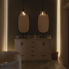 a bathroom with two sinks and lights on the wall next to it's bathtub