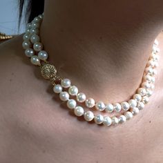 "Why wear one string when you can wear two?" Coco Chanel. You can never go wrong with a classic double strands of pearls!Large White ( some light pink and peach overtone) Round, high-luster with typical natural blemishes Japanese Cultured pearls are double-knotted in this unforgettable piece, finished with a striking 14K Yellow gold clasp.Each pearl measures approx. 7.5mm in average with a total strands length of 16" and 17 inches. The weight 61.40gm.The 14k Yellow Gold ( stamped), Open Filigree Luxury Hand-strung Pearl Necklace With Round Beads, Luxury Gold Double Strand Beaded Necklace, Classic Double Strand Pearl Pendant Necklace, Classic Double Strand Pearl Necklace With Pendant, Classic Double Strand Pearl White Necklace, Pearl White Double Strand Akoya Pearl Necklace, Double Strand Akoya Pearl Necklace In Pearl White, Pearl White Akoya Pearl Double Strand Necklace, Elegant Double Strand Akoya Pearl Necklace